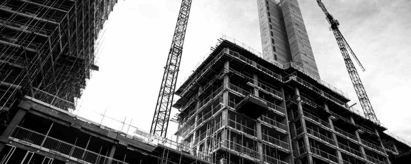 A black and white image of a construction site