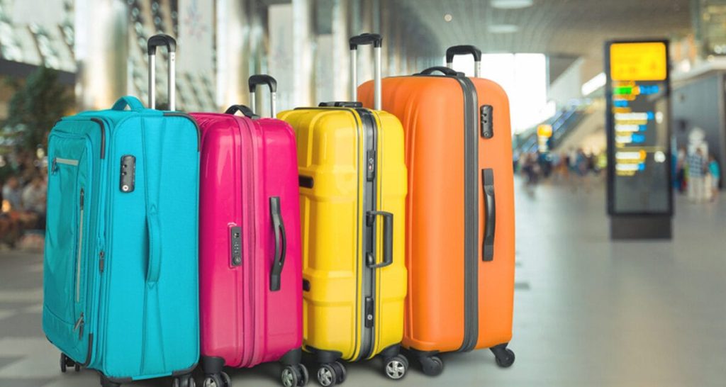 Vibrant, colorful luggage bags at the airport helpful in prevent luggage theft by making bags easily identifiable