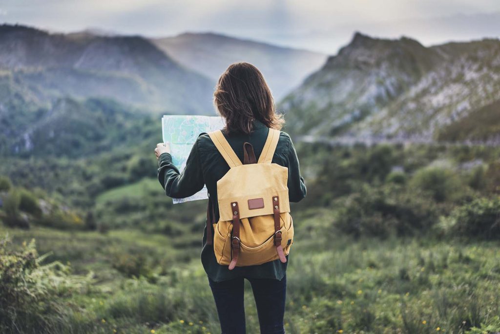 An image of a solo female traveller exploring new places.